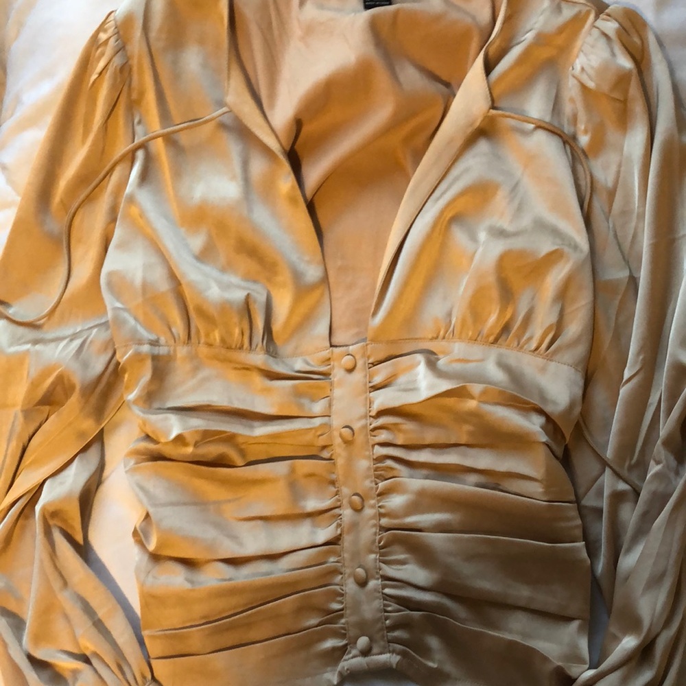 It’s a blouse it’s a very silky material! FOREVER 21